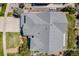 An aerial view of the home showing the roof, landscaping, and driveway at 26764 E Canyon Ave, Aurora, CO 80016