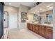Primary bathroom features double vanity with ample storage, walk in shower, and linen closet at 26764 E Canyon Ave, Aurora, CO 80016