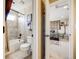 Bathroom featuring a tub and shower combination with tiled walls and neutral tile floors at 26764 E Canyon Ave, Aurora, CO 80016