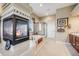 Elegant primary bathroom boasts fireplace, soaking tub, and glass enclosed shower at 26764 E Canyon Ave, Aurora, CO 80016