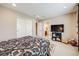 Bedroom with carpet, and view into the bathroom at 26764 E Canyon Ave, Aurora, CO 80016