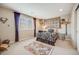 Cozy bedroom features neutral walls, window, and fun decor at 26764 E Canyon Ave, Aurora, CO 80016