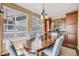 Inviting dining room with a wooden table, comfortable chairs, and ample natural light at 26764 E Canyon Ave, Aurora, CO 80016