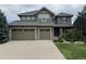 Charming two-story home featuring a three-car garage and meticulous landscaping at 26764 E Canyon Ave, Aurora, CO 80016