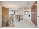 Elegant upper hallway boasts decorative railing, pendant lighting and built in cabinetry at 26764 E Canyon Ave, Aurora, CO 80016