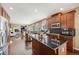 Stylish kitchen with granite countertops, stainless steel appliances, and an island for food preparation at 26764 E Canyon Ave, Aurora, CO 80016