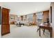 Open living room features neutral decor, work space and cozy furniture at 26764 E Canyon Ave, Aurora, CO 80016