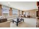 Spacious living room with comfortable seating and natural light at 26764 E Canyon Ave, Aurora, CO 80016