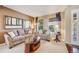 Cozy living room featuring comfortable seating, tasteful decor, and ample natural light at 26764 E Canyon Ave, Aurora, CO 80016