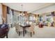 Open-concept living and dining area with natural light, stylish decor, and comfortable seating at 26764 E Canyon Ave, Aurora, CO 80016