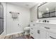 Elegant bathroom featuring a modern vanity, sleek fixtures, and a well-lit mirror at 4899 S Dudley St # 14F, Littleton, CO 80123