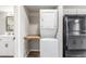 A convenient laundry area and sink located close to the kitchen with butcher block counter at 4899 S Dudley St # 14F, Littleton, CO 80123