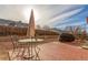 Backyard featuring patio, gravel, fenced perimeter, an umbrella table and a grill with cover at 4094 S Lisbon Way, Aurora, CO 80013