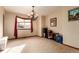 Spacious room with natural light, neutral walls, and a decorative chandelier at 4094 S Lisbon Way, Aurora, CO 80013