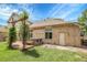 Backyard featuring a hot tub, a small wooden deck, and a well-maintained lawn at 11411 W Cooper Dr, Littleton, CO 80127