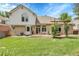 Spacious backyard featuring a grassy area, hot tub, and access to the home at 11411 W Cooper Dr, Littleton, CO 80127