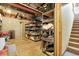 Unfinished basement with storage shelves and exposed ceiling beams at 11411 W Cooper Dr, Littleton, CO 80127