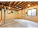 Unfinished basement with concrete walls and exposed ceiling at 11411 W Cooper Dr, Littleton, CO 80127