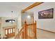 Bright foyer with hardwood railing staircase and chandelier at 11411 W Cooper Dr, Littleton, CO 80127