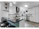 This contemporary kitchen features granite countertops, modern appliances, and a unique backsplash design at 11411 W Cooper Dr, Littleton, CO 80127