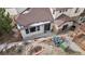 Aerial view of a home with a cozy patio and landscaped yard at 4415 Echo Ct, Larkspur, CO 80118