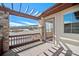 Spacious balcony with stone accents provides tranquil outdoor living and beautiful vistas at 4415 Echo Ct, Larkspur, CO 80118