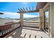Stunning outdoor balcony features stone pillars and a pergola overlooking mountain views at 4415 Echo Ct, Larkspur, CO 80118