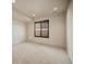 Well-lit bedroom with a window and neutral carpet at 4415 Echo Ct, Larkspur, CO 80118
