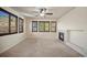 Bright bedroom with large windows, cozy fireplace and a ceiling fan at 4415 Echo Ct, Larkspur, CO 80118