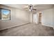 Bright bonus room featuring neutral walls, plush carpet, and a large window overlooking the landscape at 4415 Echo Ct, Larkspur, CO 80118