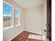 Cozy entryway featuring tile flooring and natural light from large windows at 4415 Echo Ct, Larkspur, CO 80118