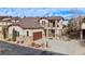 Inviting two-story home featuring a stucco and stone facade, a two car garage, and a covered balcony at 4415 Echo Ct, Larkspur, CO 80118