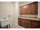 Functional laundry room with ample cabinetry and sink for added convenience at 4415 Echo Ct, Larkspur, CO 80118