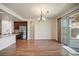 Open floor plan featuring the kitchen, dining area, and sliding doors leading to outdoor space at 4415 Echo Ct, Larkspur, CO 80118