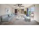 Living room featuring contemporary furnishings, carpet, a window with shutters, and access to a balcony at 4415 Echo Ct, Larkspur, CO 80118