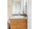 Clean bathroom features a wood vanity with a modern sink and chrome fixtures at 7080 W Custer Ave, Lakewood, CO 80226