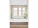 Serene soaking tub in a bright bathroom with large windows and plants, perfect for relaxation at 7080 W Custer Ave, Lakewood, CO 80226