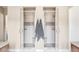 Modern bathroom features dual walk-in showers with glass doors, benches, and neutral tile work at 7080 W Custer Ave, Lakewood, CO 80226