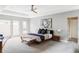 Spacious bedroom with neutral tones, a ceiling fan, and large windows allowing for plenty of natural light at 7080 W Custer Ave, Lakewood, CO 80226