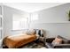 Cozy bedroom with natural light, neutral tones, and minimalist decor at 7080 W Custer Ave, Lakewood, CO 80226