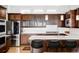 Gourmet kitchen features stainless steel appliances and a sleek breakfast bar at 7080 W Custer Ave, Lakewood, CO 80226