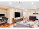 Open living space with modern lighting, large television, and stylish décor at 7080 W Custer Ave, Lakewood, CO 80226