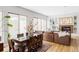 Bright living and dining room with a fireplace, and large windows at 7080 W Custer Ave, Lakewood, CO 80226