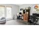 Home office area with a desk, chair, and large window offering plenty of natural light at 7080 W Custer Ave, Lakewood, CO 80226