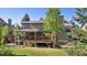 Lovely backyard with a large wooden deck and covered patio space for entertaining at 2317 Wynterbrook Dr, Highlands Ranch, CO 80126