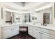 Large vanity with and sinks, lots of storage and a makeup area with a stool at 2317 Wynterbrook Dr, Highlands Ranch, CO 80126