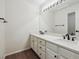 Bright bathroom featuring a double sink vanity with modern fixtures and ample counter space at 2317 Wynterbrook Dr, Highlands Ranch, CO 80126