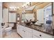 Unique bathroom features vessel sinks, granite countertop, and tile flooring at 2317 Wynterbrook Dr, Highlands Ranch, CO 80126