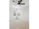 Simple bedroom featuring a ceiling fan, a window and minimal fixtures at 2317 Wynterbrook Dr, Highlands Ranch, CO 80126