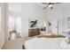 Bright bedroom with high ceiling, neutral carpet, and doorway views to other rooms at 2317 Wynterbrook Dr, Highlands Ranch, CO 80126